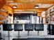 Modern kitchen with black cabinetry and bar stool seating at 3945 Douglas Mountain Dr, Golden, CO 80403
