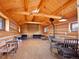 Spacious living area with wood paneling, a fireplace, and comfortable seating arrangements at 3945 Douglas Mountain Dr, Golden, CO 80403