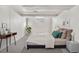 A bedroom with a modern gray aesthetic, minimalist decor, and gray carpeting at 4518 Elm Ct, Denver, CO 80211