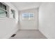 Bright bedroom with two windows and neutral carpet at 4518 Elm Ct, Denver, CO 80211