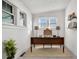 Bright office with two windows, shelving, and a desk at 4518 Elm Ct, Denver, CO 80211