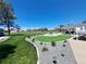 Landscaped backyard featuring a well-manicured lawn, gravel pathways, and a cozy seating area at 15945 Delta Ct, Brighton, CO 80603