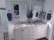 Elegant bathroom with double sinks, marble countertops, and modern fixtures at 15945 Delta Ct, Brighton, CO 80603