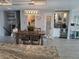 Dining area featuring a stylish table, contemporary lighting, and a built-in bar with a beverage cooler at 15945 Delta Ct, Brighton, CO 80603