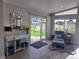 Comfortable sitting area with a sliding door to the backyard and a view of the green lawn at 15945 Delta Ct, Brighton, CO 80603