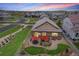 Aerial view of a well-maintained home with a beautiful backyard, patio, and manicured landscaping at 3480 Mount Powell Dr, Broomfield, CO 80023