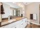 Elegant bathroom with double vanities, modern fixtures, and a glass-enclosed shower at 3480 Mount Powell Dr, Broomfield, CO 80023