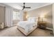 Cozy bedroom featuring a large window, soft lighting, and plush carpeting at 3480 Mount Powell Dr, Broomfield, CO 80023