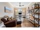 Well-lit home office featuring hardwood floors, modern furnishings, and an open feel at 3480 Mount Powell Dr, Broomfield, CO 80023