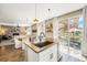 Island with sink and counterspace and Stainless Steel appliances with open view to living room at 3480 Mount Powell Dr, Broomfield, CO 80023