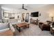 Inviting living room featuring neutral tones, comfortable seating, and ample natural light at 3480 Mount Powell Dr, Broomfield, CO 80023