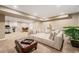Spacious basement living room featuring recessed lighting, plants, and comfortable sofa at 3480 Mount Powell Dr, Broomfield, CO 80023