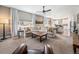 Bright living room with a large sectional sofa, stylish decor, and an open floor plan at 3480 Mount Powell Dr, Broomfield, CO 80023