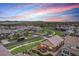 Aerial view of a peaceful neighborhood at dusk, with well-maintained homes and landscaping at 3480 Mount Powell Dr, Broomfield, CO 80023