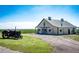Charming barn with a vintage tractor in a picturesque rural setting at 46122 County Road 53, Bennett, CO 80102