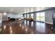 Spacious finished basement features polished concrete floors, multiple windows, and a sliding glass door at 46122 County Road 53, Bennett, CO 80102