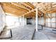 Unfinished basement with exposed beams, ready for customization and ample storage at 46122 County Road 53, Bennett, CO 80102
