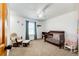 Cozy bedroom with a rocking chair and a crib at 46122 County Road 53, Bennett, CO 80102