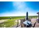 Enjoy outdoor living on this deck, complete with a dining set and views of the play set at 46122 County Road 53, Bennett, CO 80102