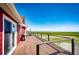 Enjoy scenic views from this large, wooden deck with modern railings and an outdoor grill perfect for entertaining at 46122 County Road 53, Bennett, CO 80102