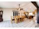 Open dining area leading to a modern kitchen with updated appliances at 46122 County Road 53, Bennett, CO 80102