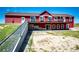 Back of the property featuring the deck and the walkout basement at 46122 County Road 53, Bennett, CO 80102