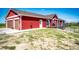 Exterior view of a two-story home with an attached garage, porch, patio, and well-maintained lawn at 46122 County Road 53, Bennett, CO 80102