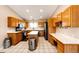 Spacious kitchen with an island, stainless steel appliances, and ample cabinet space at 46122 County Road 53, Bennett, CO 80102