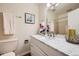 Bright bathroom featuring a modern vanity with marble countertops, decorative mirror, and a shower at 4285 S Salida Way # 17, Aurora, CO 80013