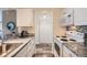 Modern kitchen features granite countertops, white appliances, and ample cabinet space at 4285 S Salida Way # 17, Aurora, CO 80013