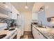 Well-lit kitchen features modern appliances, granite countertops, and ample cabinet space at 4285 S Salida Way # 17, Aurora, CO 80013