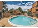 Inviting outdoor pool area with a charming cabana and lounge seating at 4285 S Salida Way # 17, Aurora, CO 80013