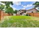 Large backyard featuring a wood fence, playset, and shed at 3973 S Joplin Way, Aurora, CO 80013