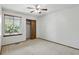 Bedroom with a ceiling fan, window with blinds, and sliding closet doors at 3973 S Joplin Way, Aurora, CO 80013
