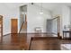 Inviting foyer with hardwood floors, stairs, and a bench near the front door at 3973 S Joplin Way, Aurora, CO 80013