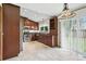 Bright kitchen featuring tile floor and stainless steel appliances at 3973 S Joplin Way, Aurora, CO 80013