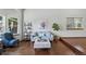 Cozy living room with a plush sofa, decorative accents, and a large window, creating a warm atmosphere at 3973 S Joplin Way, Aurora, CO 80013