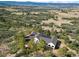 Expansive aerial view of a home, highlighting its private setting and lush landscape at 922 W Wolfensberger Rd, Castle Rock, CO 80109