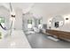 Elegant bathroom featuring dual vanities, a soaking tub, and a glass-enclosed shower at 922 W Wolfensberger Rd, Castle Rock, CO 80109