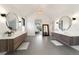 Luxurious bathroom with dual vanities, modern fixtures, and an elegant, open design at 922 W Wolfensberger Rd, Castle Rock, CO 80109