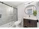 Basement bathroom with walk-in shower and modern vanity at 922 W Wolfensberger Rd, Castle Rock, CO 80109