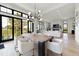 Open-concept dining area with modern lighting and seamless indoor-outdoor flow at 922 W Wolfensberger Rd, Castle Rock, CO 80109