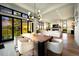 Dining room with modern chandelier, seating for eight, hardwood floors, and floor to ceiling windows at 922 W Wolfensberger Rd, Castle Rock, CO 80109