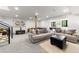 Open-concept living room with stylish sofas, a coffee table, and plenty of space for entertaining at 922 W Wolfensberger Rd, Castle Rock, CO 80109