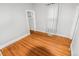 Bright bedroom with hardwood floors and a closet at 1317 S University Blvd, Denver, CO 80210