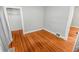Simple bedroom featuring hardwood floors and a closet at 1317 S University Blvd, Denver, CO 80210