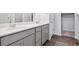 Modern bathroom featuring double sinks with gray cabinets and quartz countertops at 1321 Loraine N Cir, Lafayette, CO 80026