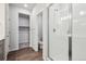 Modern bathroom with glass enclosed shower, gray cabinets and vinyl flooring at 1321 Loraine N Cir, Lafayette, CO 80026