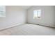 Neutral carpeted bedroom has two windows letting in bright natural light at 1321 Loraine N Cir, Lafayette, CO 80026