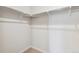 Empty closet with a metal clothing rod and white walls, providing ample storage space in this home at 1321 Loraine N Cir, Lafayette, CO 80026